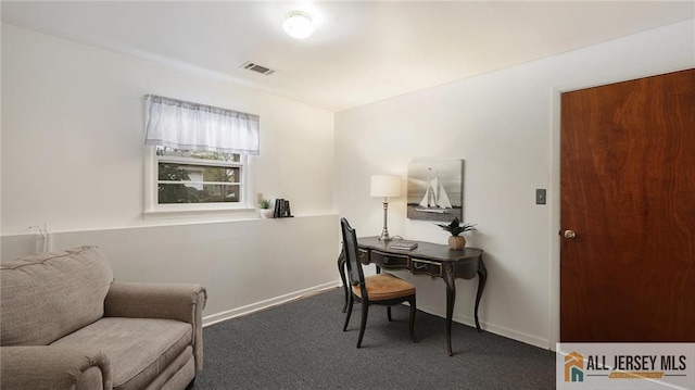 carpeted office featuring baseboards and visible vents