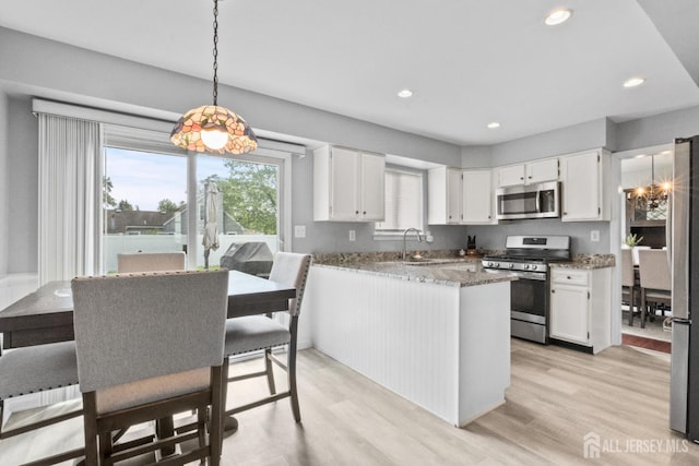 3 Mendon Ct, Howell, NJ 07731 - kitchen featuring appliances with stainless steel finishes, white cabinets, light wood-style flooring, and recessed lighting