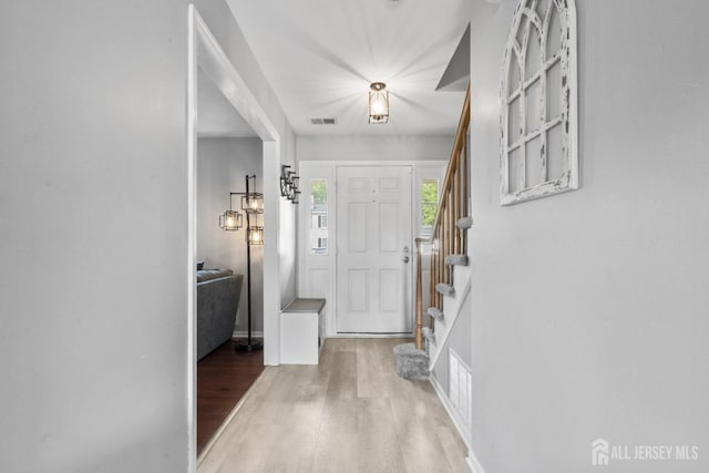 3 Mendon Ct, Howell, NJ 07731 - entrance foyer with light wood finished floors and stairs