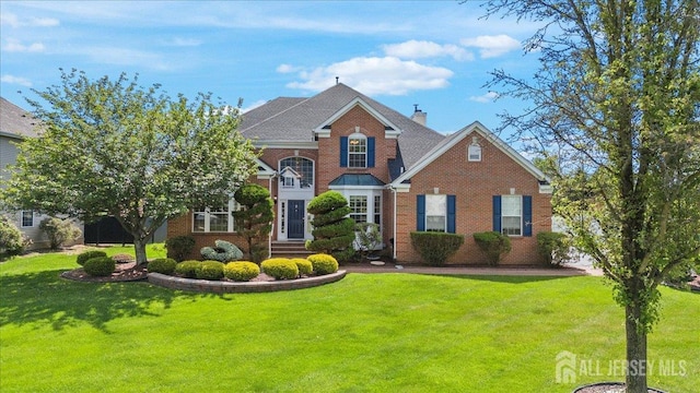 7 Arbutus Way S, Brunswick, NJ 08852 - view of front facade with brick siding, a front yard, and a chimney