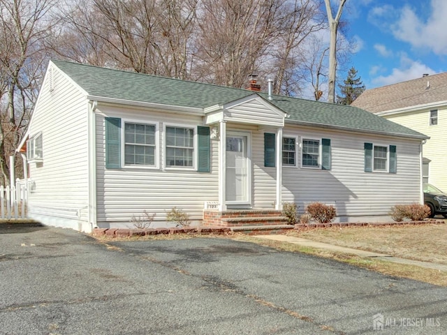 123 3rd St, Middlesex, NJ 08846 - bungalow-style home with a shingled roof and entry steps