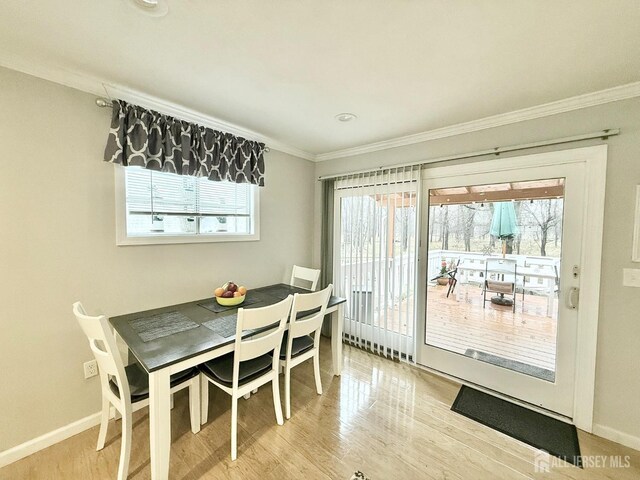 123 3rd St, Middlesex, NJ 08846 - dining area with crown molding, wood finished floors, and baseboards