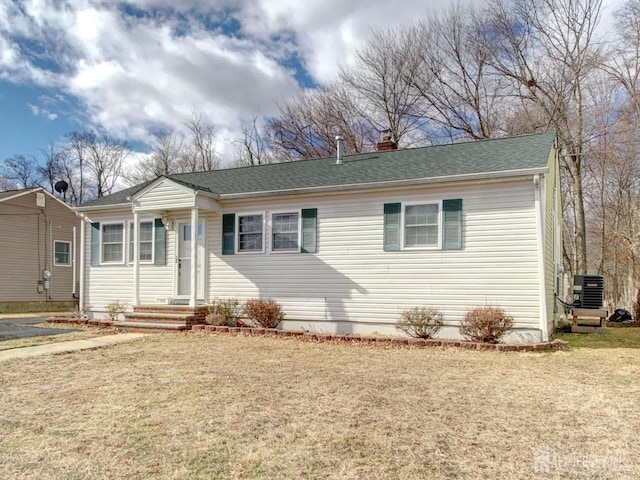 123 3rd St, Middlesex, NJ 08846 - view of front of home with a chimney, a front yard, and central air condition unit