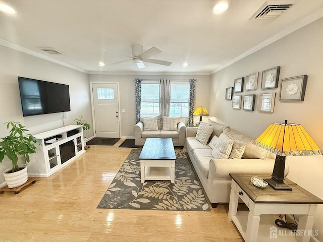 123 3rd St, Middlesex, NJ 08846 - living area featuring ceiling fan, crown molding, recessed lighting, wood finished floors, and baseboards