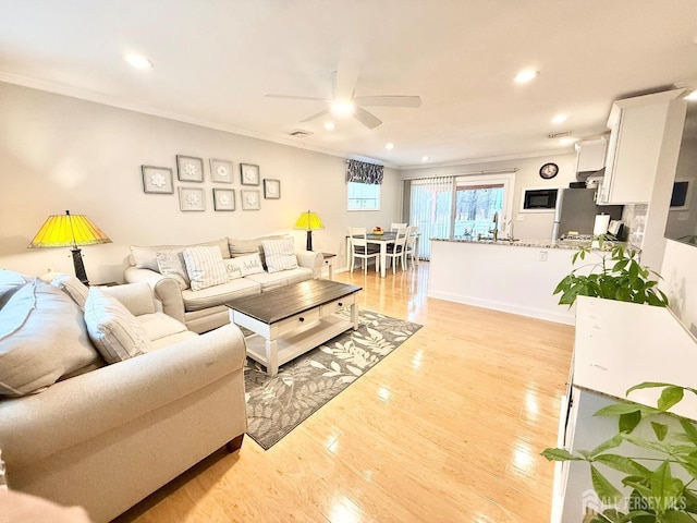 123 3rd St, Middlesex, NJ 08846 - living area featuring a ceiling fan, crown molding, light wood finished floors, and recessed lighting