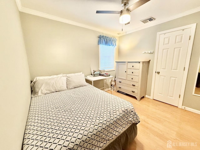 123 3rd St, Middlesex, NJ 08846 - bedroom featuring ornamental molding, light wood-type flooring, baseboards, and ceiling fan