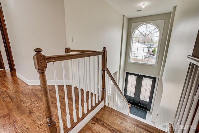 entryway featuring wood finished floors and baseboards