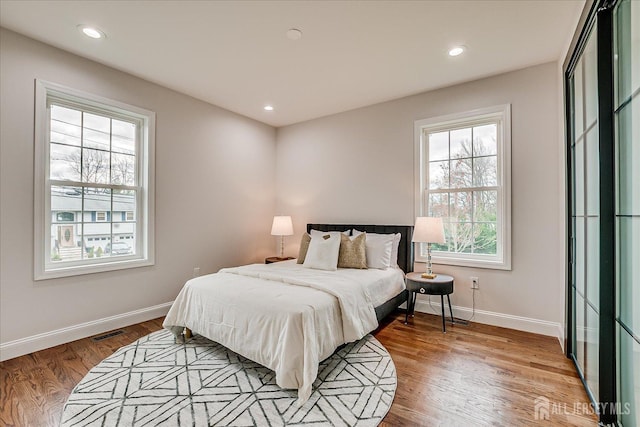 bedroom with recessed lighting, baseboards, visible vents, and light wood-style flooring