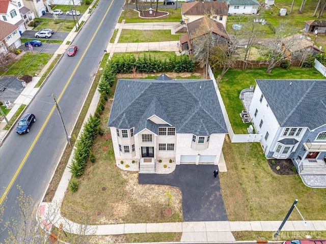 birds eye view of property with a residential view