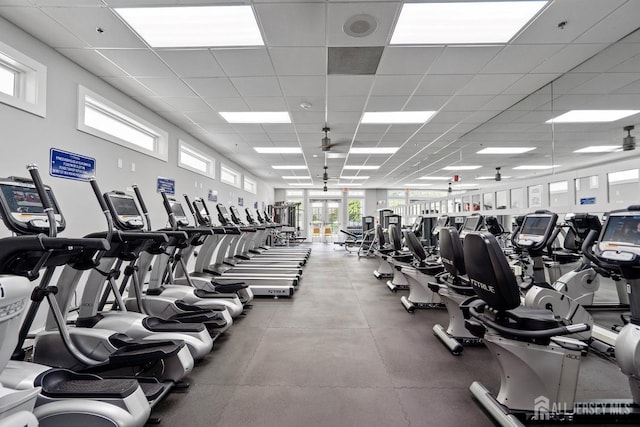 exercise room featuring a paneled ceiling