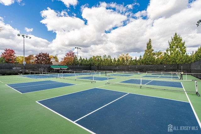 view of sport court featuring community basketball court and fence