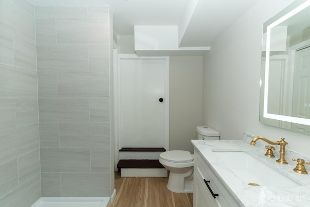 100 Cutters Dock Rd, Woodbridge Proper, NJ 07095 - bathroom with vanity, wood finished floors, and tiled shower