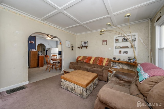 667 Seminary Ave, Rahway, NJ 07065 - tiled living room with arched walkways, coffered ceiling, and carpet