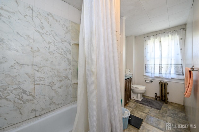 667 Seminary Ave, Rahway, NJ 07065 - full bathroom with radiator heating unit, shower / bath combo, and vanity