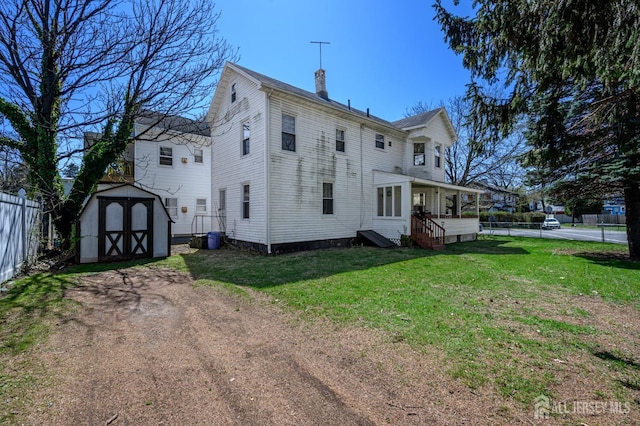667 Seminary Ave, Rahway, NJ 07065 - back of house with a chimney and a storage shed