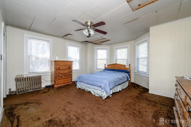 667 Seminary Ave, Rahway, NJ 07065 - bedroom featuring radiator heating unit, dark carpet, and ceiling fan