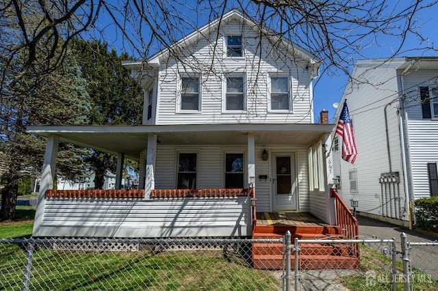667 Seminary Ave, Rahway, NJ 07065 - american foursquare style home featuring covered porch, a gate, and a fenced front yard