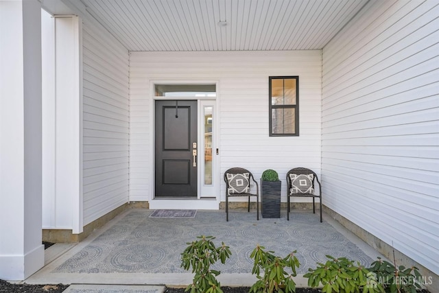 doorway to property with covered porch