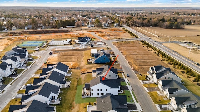 birds eye view of property with a residential view