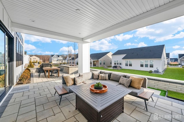 view of patio with a residential view, outdoor dining space, and outdoor lounge area