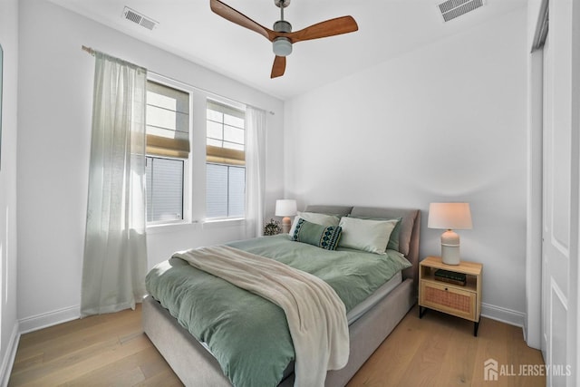 bedroom with ceiling fan and light hardwood / wood-style flooring