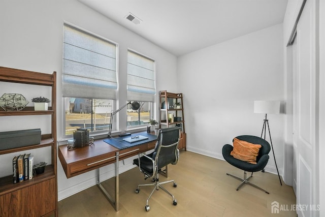 home office with light wood-type flooring