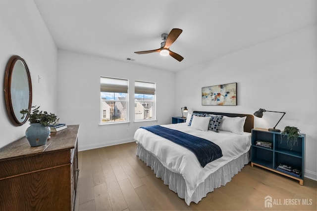 bedroom featuring ceiling fan and light hardwood / wood-style flooring