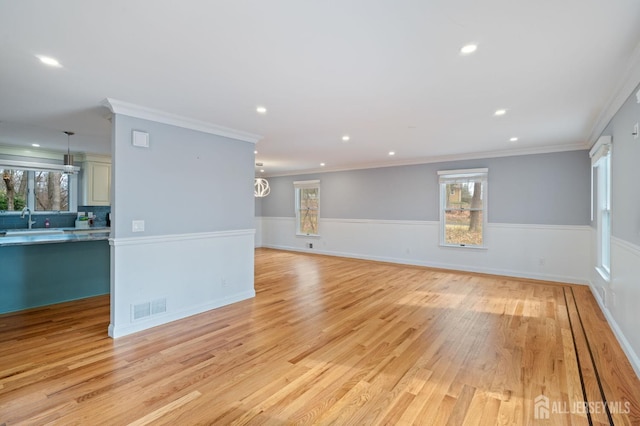 18 Back Bone Hill Rd, Millstone, NJ 08510 - empty room with light wood finished floors, wainscoting, plenty of natural light, recessed lighting, and a sink