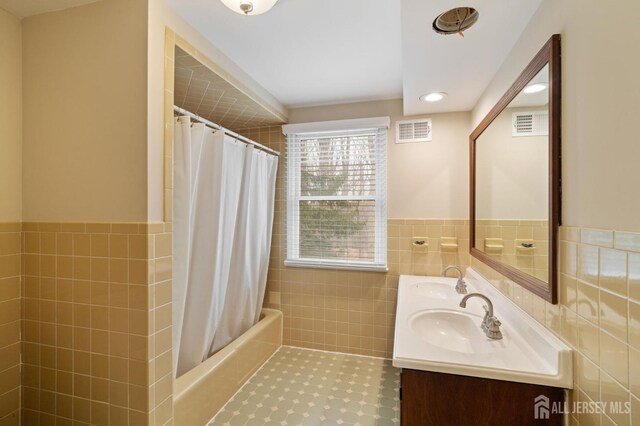 18 Back Bone Hill Rd, Millstone, NJ 08510 - bathroom with tile walls, a wainscoted wall, double vanity, shower / tub combo, and recessed lighting