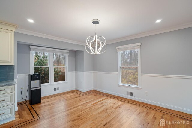 18 Back Bone Hill Rd, Millstone, NJ 08510 - unfurnished dining area with a chandelier, light wood-style floors, crown molding, and baseboards
