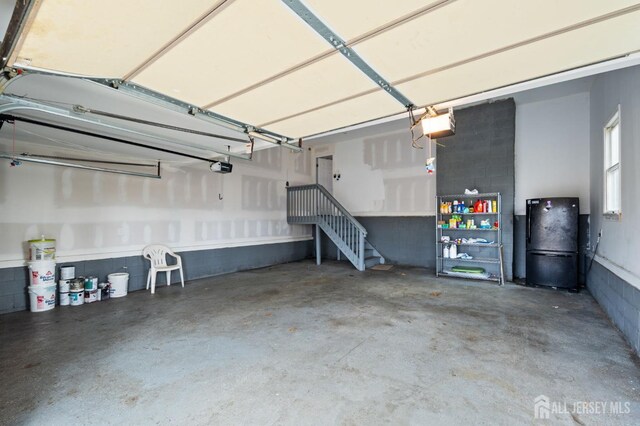18 Back Bone Hill Rd, Millstone, NJ 08510 - garage with freestanding refrigerator and a garage door opener
