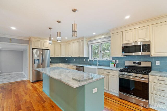 18 Back Bone Hill Rd, Millstone, NJ 08510 - kitchen featuring appliances with stainless steel finishes, light stone countertops, a sink, a center island, and backsplash