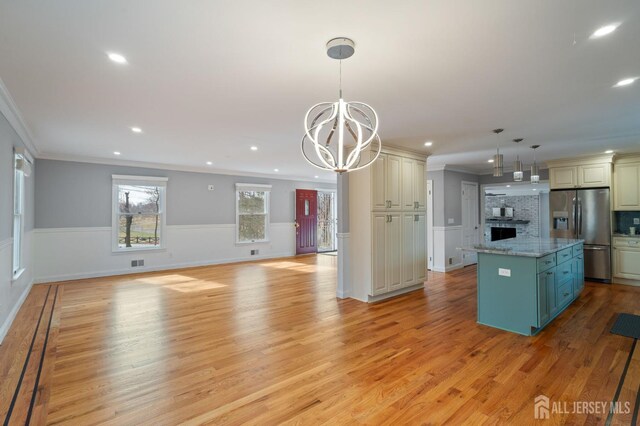 18 Back Bone Hill Rd, Millstone, NJ 08510 - kitchen featuring stainless steel refrigerator with ice dispenser, ornamental molding, a kitchen island, a chandelier, and recessed lighting