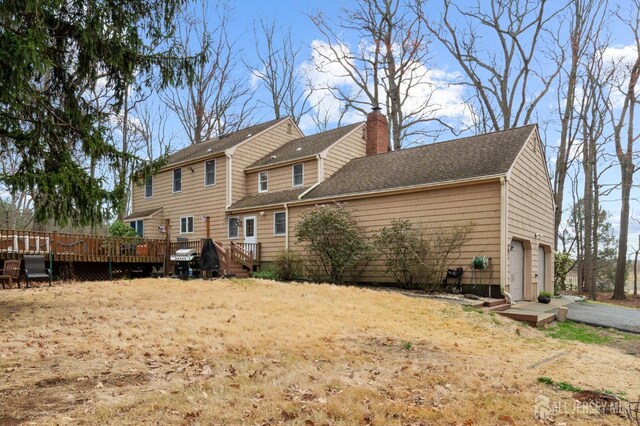 18 Back Bone Hill Rd, Millstone, NJ 08510 - rear view of house featuring a deck, a garage, and a chimney