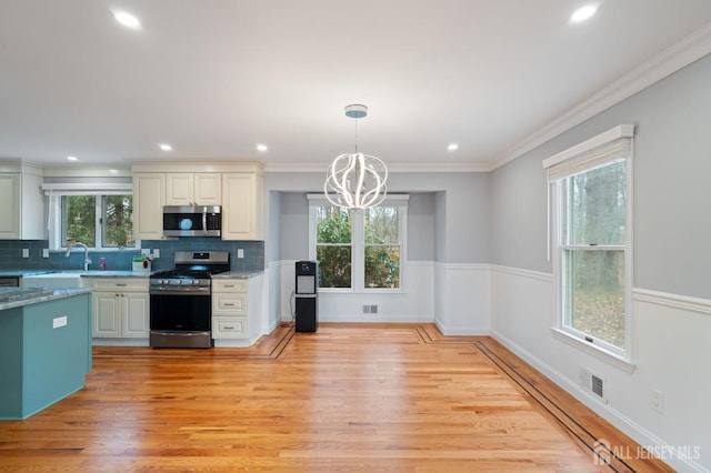18 Back Bone Hill Rd, Millstone, NJ 08510 - kitchen featuring stainless steel appliances, a chandelier, tasteful backsplash, light wood-style flooring, and recessed lighting