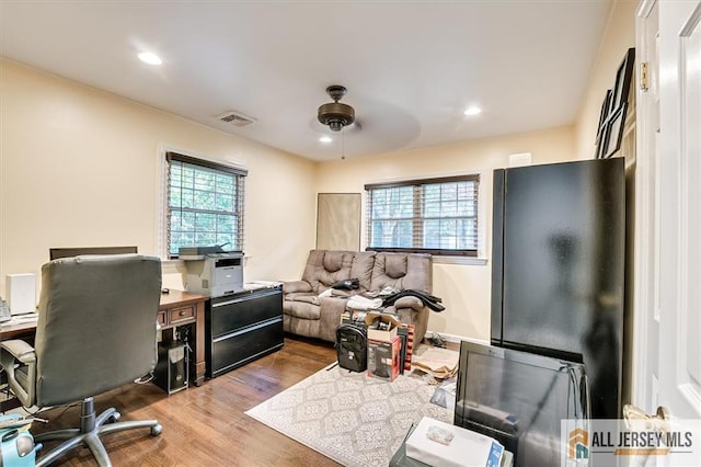 office featuring ceiling fan and hardwood / wood-style floors