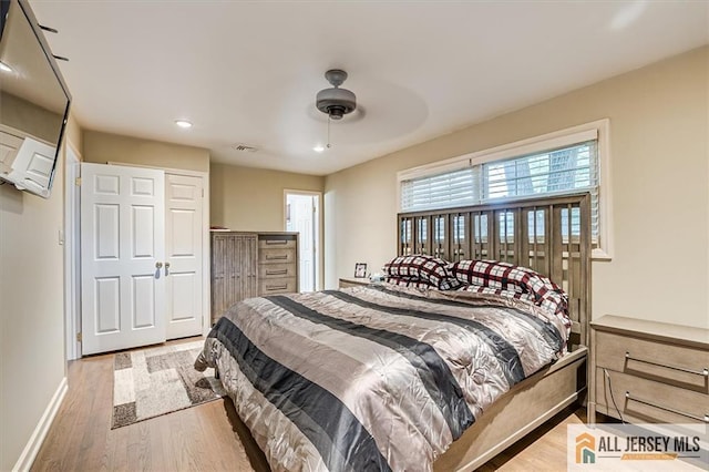 bedroom featuring hardwood / wood-style flooring and ceiling fan