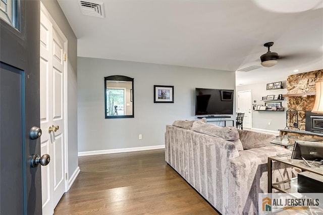 living room with hardwood / wood-style flooring and ceiling fan