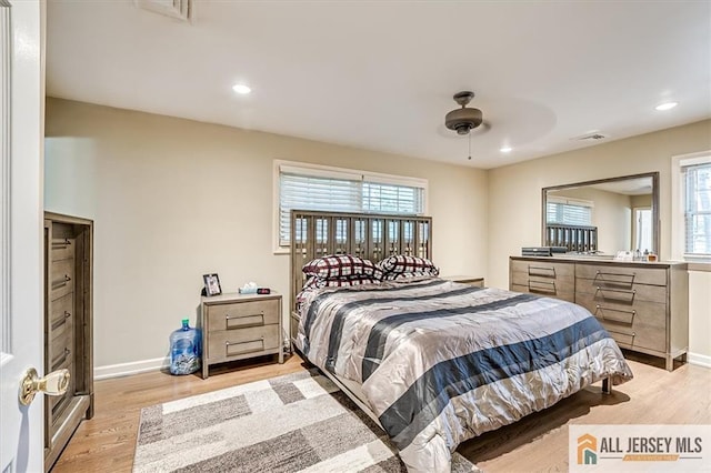 bedroom featuring ceiling fan and light hardwood / wood-style flooring