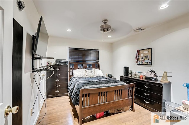 bedroom with light hardwood / wood-style floors and ceiling fan