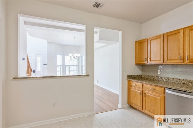 199 Pinelli Dr, Piscataway, NJ 08854 - kitchen featuring dishwasher, a chandelier, tasteful backsplash, light stone countertops, and light tile patterned floors