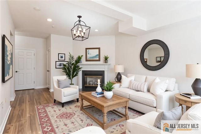 199 Pinelli Dr, Piscataway, NJ 08854 - living room featuring wood finished floors, a chandelier, recessed lighting, and a fireplace with flush hearth