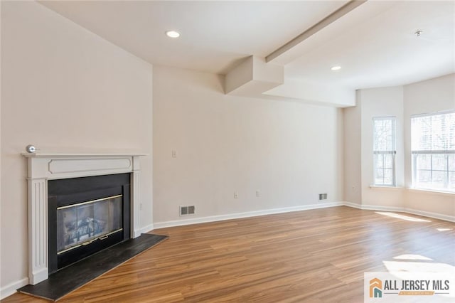 199 Pinelli Dr, Piscataway, NJ 08854 - unfurnished living room with wood finished floors, recessed lighting, a glass covered fireplace, and beam ceiling