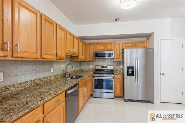 199 Pinelli Dr, Piscataway, NJ 08854 - kitchen with appliances with stainless steel finishes, stone countertops, and decorative backsplash