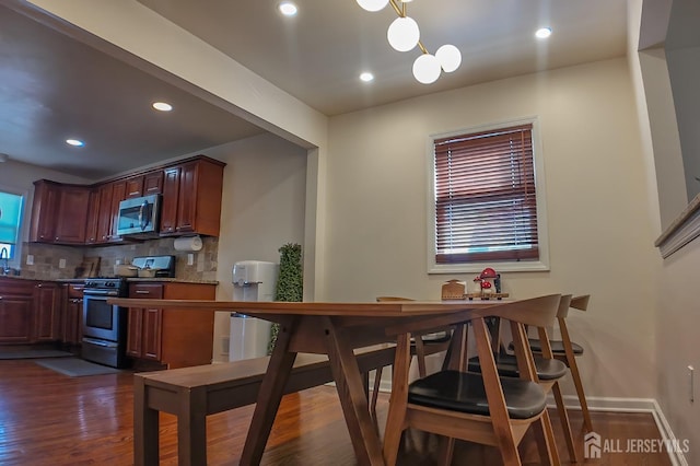 202 Jackson Ave, Edison, NJ 08837 - kitchen with stainless steel appliances, decorative backsplash, dark wood-type flooring, recessed lighting, and pendant lighting