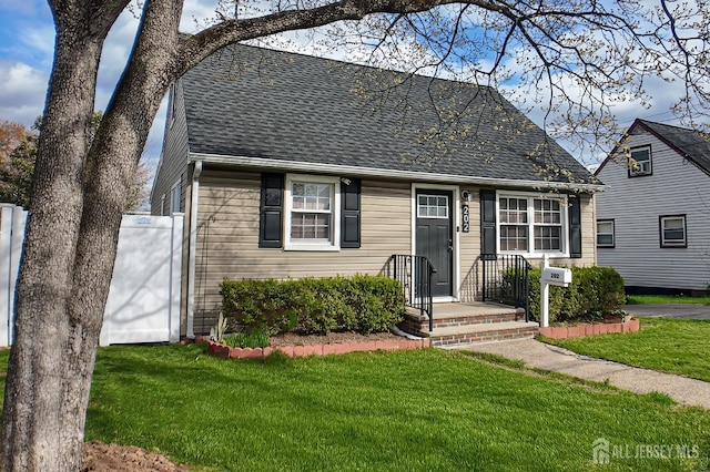 202 Jackson Ave, Edison, NJ 08837 - new england style home with roof with shingles and a front lawn