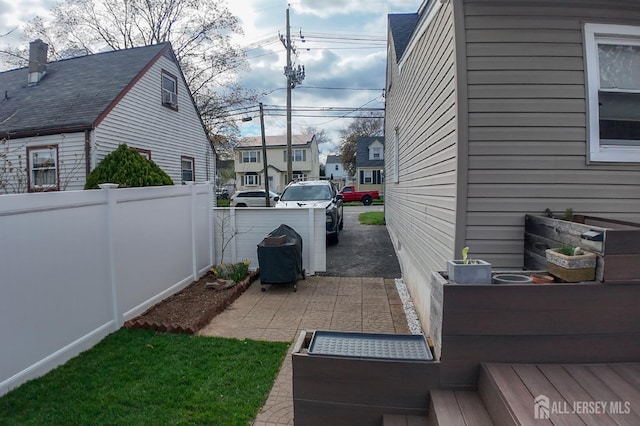 202 Jackson Ave, Edison, NJ 08837 - view of side of property featuring fence and a residential view