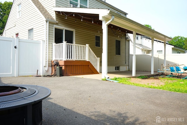 709 Wadsworth Ave, South Plainfield, NJ 07080 - view of side of home featuring a gate, a patio area, and a fire pit
