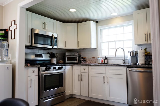 709 Wadsworth Ave, South Plainfield, NJ 07080 - kitchen featuring stainless steel appliances, white cabinetry, decorative backsplash, recessed lighting, and wooden ceiling
