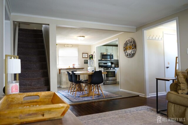 709 Wadsworth Ave, South Plainfield, NJ 07080 - dining room with stairs, crown molding, and wood-type flooring